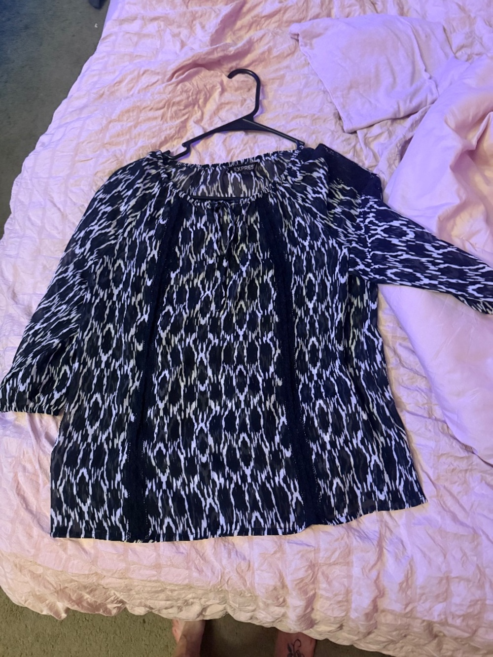 Express blouse size small in women.